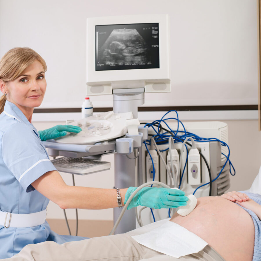 nurse-giving-ultrasound-scan-to-pregnant-woman-in-2025-10-14-05-13-16-utc